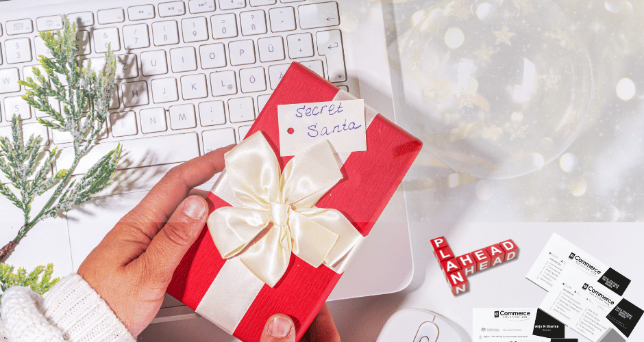 Holiday-themed workspace with a laptop displaying a digital marketing dashboard, surrounded by festive decorations like gift boxes, a small Christmas tree, and fairy lights